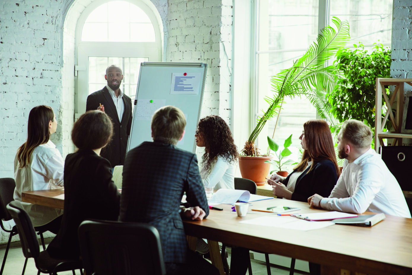 Group Of Young Business Professionals Having A Meeting, Creative Office